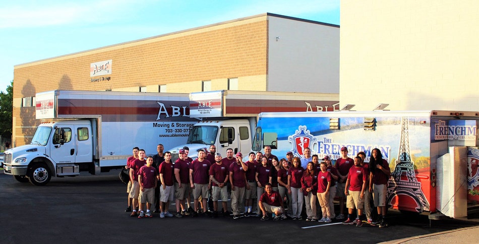 Crew in front of trucks
