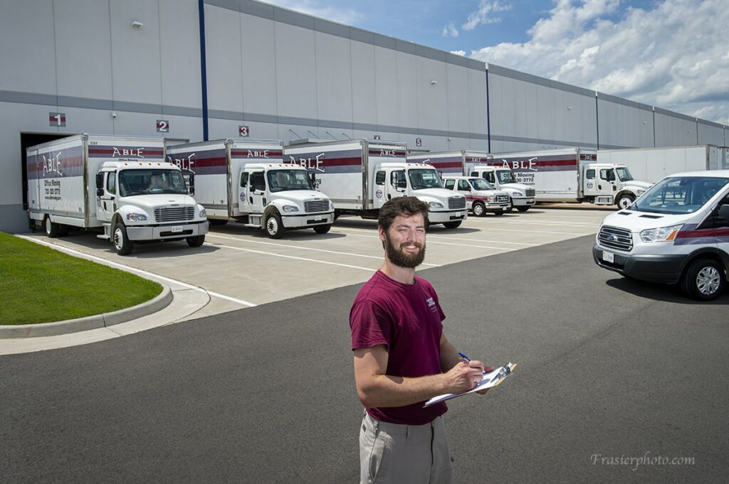 Employee in front of building
