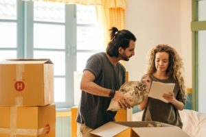 A Chantilly VA couple packing up boxes for a residential moving service